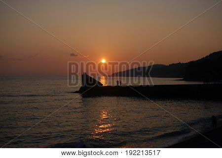 Sunset above mountains around sochi fisherfolk black see