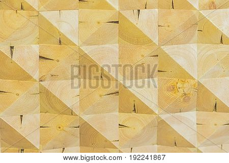 Art wooden construction. Abstract decorative ecological unpainted light wooden background with geomethrical mosaik wood pattern close-up, natural surface. Wood texture with scratches and cracks