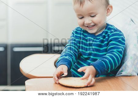 The Boy In The Kitchen Eating Cookies