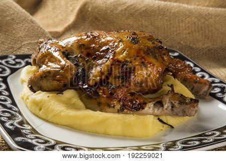 Little Chicken Dish With Polenta On Wood Background