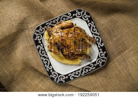 Little Chicken Dish With Polenta On Wood Background