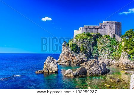 Amazing summer landscape in Dubrovnik with beach under famous historic fort, Croatia, popular european travel resort.
