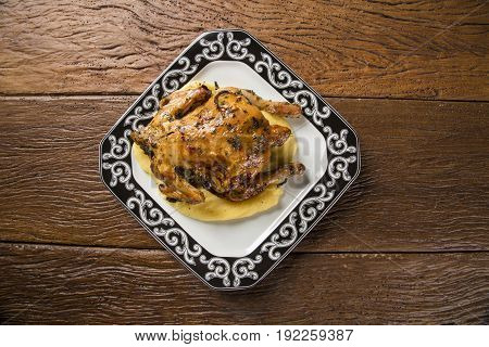 Little Chicken Dish With Polenta On Wood Background