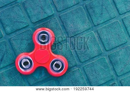 Top view of a red fidget spinner