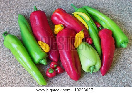 Mixture of sizes, colors and tastes - sweet and hot peppers