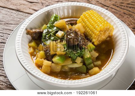 South American Cuisine: Puchero Soup With Chickpeas Close-up In A Pot On The Table.