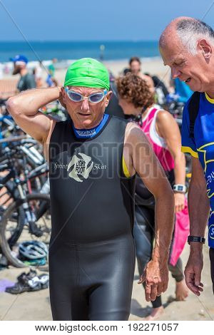 Kijkduin The Hague the Netherlands - 17 June 2017: Kijkduin cross triathlon senior participant about to do swim leg