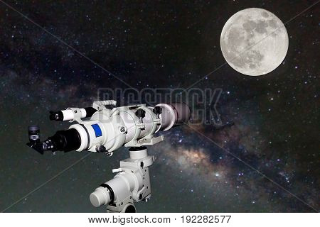 Telescope watching the Milky Way galaxy and Full moon on dark night at thailand