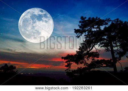 Full moon and sunset on mountain in thailand