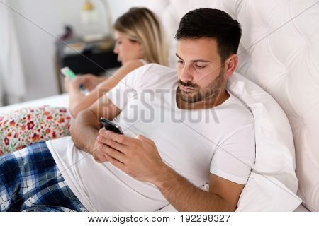 Unhappy sad young couple having unsolved relationship problems