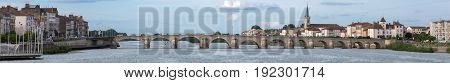 Macon and Pont Saint-Laurent river Saone, France