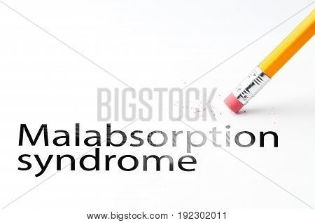 Closeup of pencil eraser and black malabsorption syndrome text. Malabsorption syndrome. Pencil with eraser.
