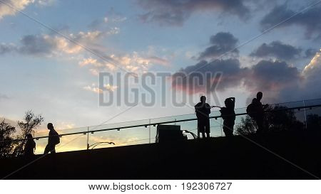 Tourists caught during a sunset in Mexico Ciry downtown. A view from Estela de Luz tower (downstaris)