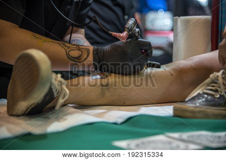 Tattoo Artist Drawing Art On Body