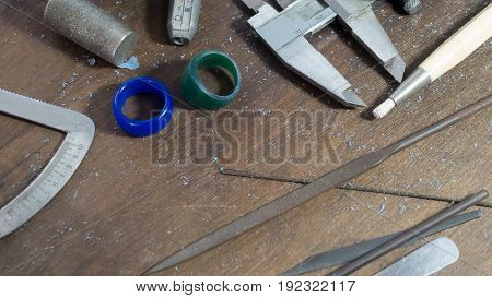 Jewelry making tool,Tools, components and finished mold lie on a bench in the handcraft.