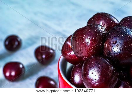 Ripe Cherry Fruits In Old Style Enamel Iron Jar,