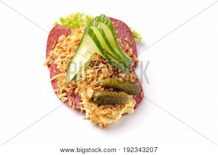 Danish specialties and national dishes high-quality open sandwich Salami with crispy fried onion remoulade and cucumber isolated on white background