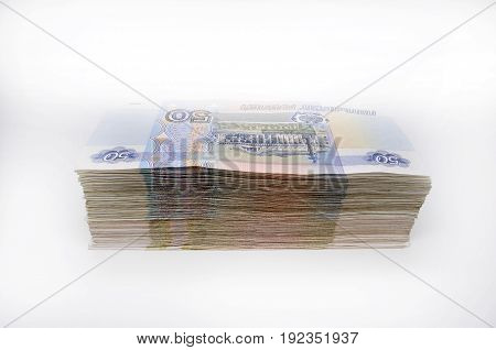 really two packs of 100 pieces banknotes 100 one hundred fifty rubles and 50 roubles banknotes of Bank of Russia on white background Russian rubles
