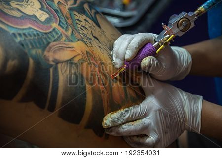 Tattoo Artist Drawing Art On Body