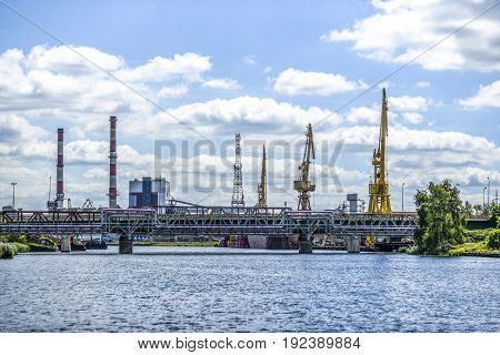 Landscape of industrial Szczecin in Poland. River craines bridge.