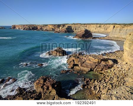 Rocky beach and waves from up above