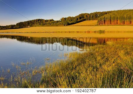 beautiful landscape with a lake at sunset
