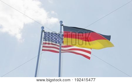 USA and Germany, two flags waving against blue sky. 3d illustration