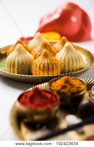 A modak is an Indian sweet dumpling popular in many parts of India. It is called modak in Marathi and Konkani as well as Gujarati language, Kozhakkatta in Malayalam, modhaka or kadubu in Kannada