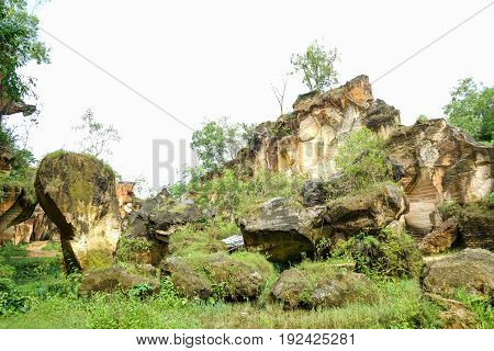 The exploitation of limestone hills canyon forming a unique architectural in Arosbaya Hill Madura Island, Indonesia