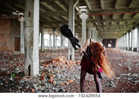 Red Haired Punk Girl Wear On Black And Red Skirt, With Bass Guitar At Abadoned Place. Portrait Of Go