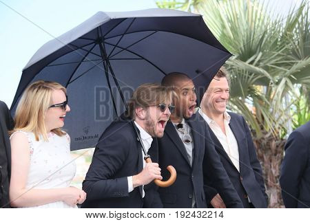 Claes Bang, Elisabeth Moss, Ruben Ostlund, Christopher Laesso and Dominic West attend the 'The Square' photocall during the 70th Cannes Film Festival at Palais on May 20, 2017 in Cannes, France. 