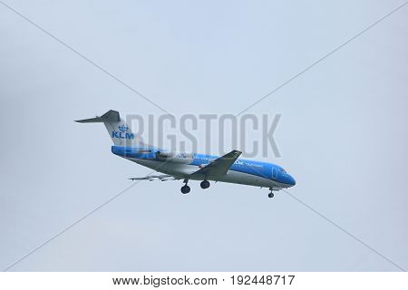 Amsterdam the Netherlands - June 22nd 2017: PH-KZM KLM Cityhopper Fokker F70 approaching Polderbaan runway at Schiphol Amsterdam Airport the Netherlands