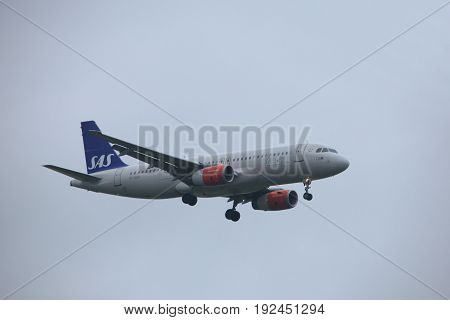 Amsterdam the Netherlands - June 22nd 2017: OY-KAO SAS Scandinavian Airlines Airbus A320 approaching Polderbaan runway at Schiphol Amsterdam Airport the Netherlands