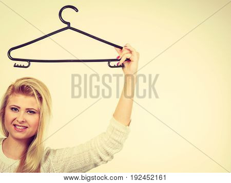 Woman Holding Clothes Hanger