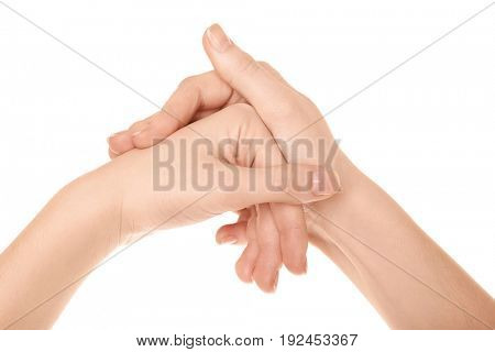 Hands of woman suffering from pain in joints on white background. Concept of orthopedist attendance