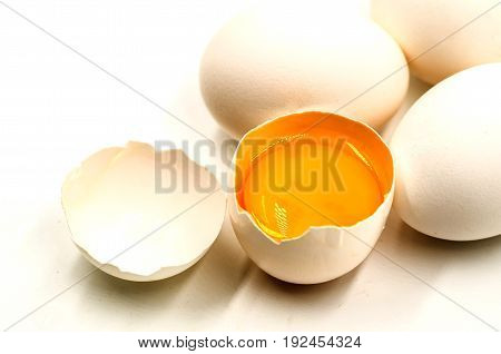 fresh eggs with yellow yalk on the black background