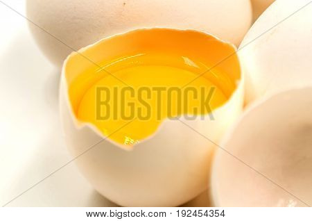 fresh eggs with yellow yalk on the black background