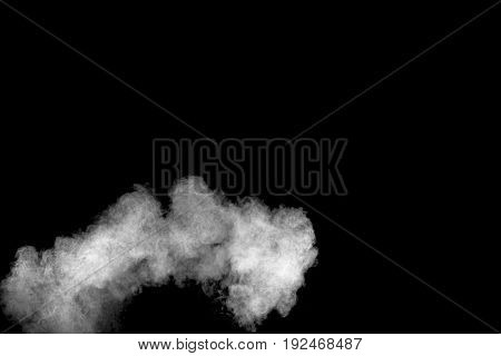 white Powder explosion on black background. White dust explode.