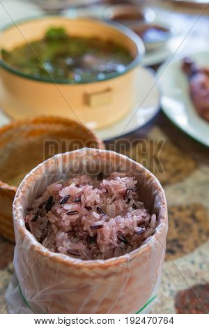Thai sticky brown rice served in a local ware