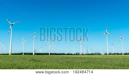 Wind power plant with many windmills seen in Germany