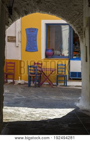 IOULIDA, GREECE - MAY 26, 2017: Coffee shop in Ioulida village on Kea island in Greece on May 26, 2017.