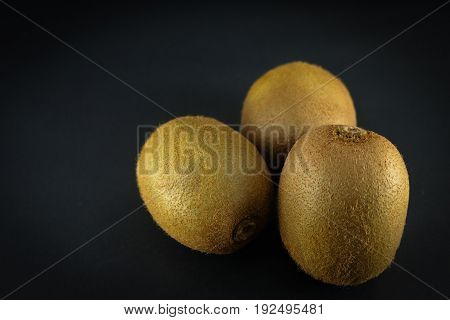 Kiwi fruit is good for health,Fresh kiwis on black background