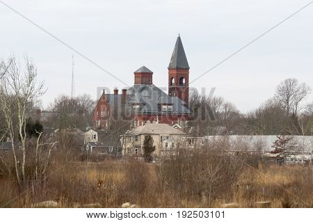 Rogers School rising over field at Atlas Tack Superfund site in Fairhaven Massachusetts