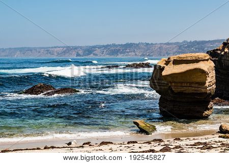 Natural sandstone rock formations near the Children's Pool in La Jolla, California.