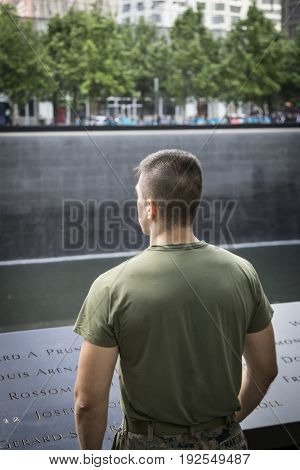 Military Freedom Run: A U.S. Marine looks to the reflecting pool of the World Trade Center Towers site after the Freedom Run to the National September 11 Memorial site Fleet Week, NEW YORK MAY 26 2017