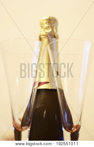 Bottle of shampagne and a pair glasses