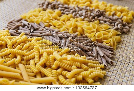 noodles pasta of different kinds scattered on the table.