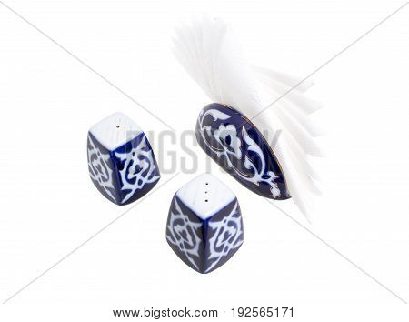 Handmade painted salt and pepperbox with napkin holder. Isolated on a white background.