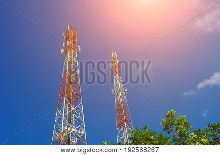 Antenna tower,Telecommunications tower in the afternoon bright sunlight and cloudy blue sky