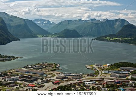 Panoramic view of the mountains around Andalsnes in Norway under a sunny sky in Romsdalsfjorden